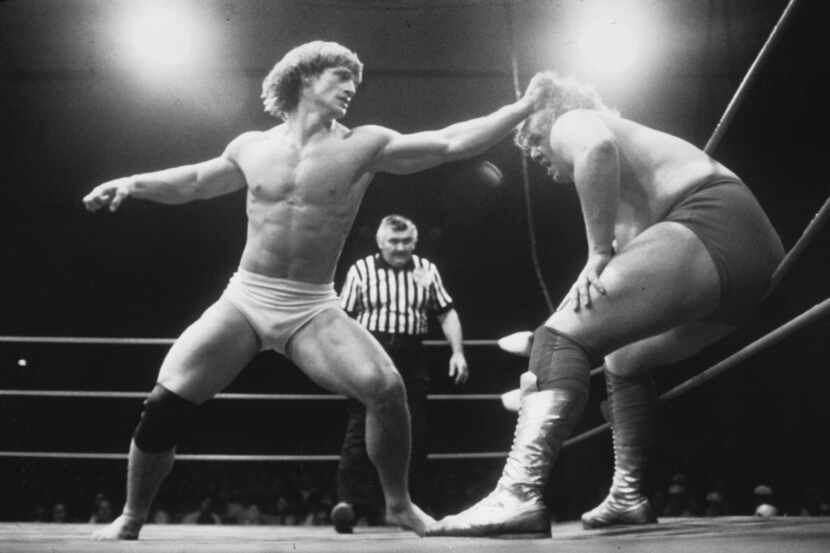Kevin Von Erich wrestles Terry Gordy, while referee Bronko Lubich watches on. In 1982, Gordy...