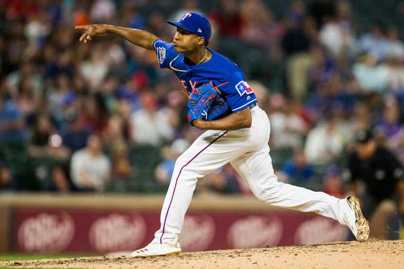 Texas Rangers relief pitcher Jose Leclerc (25) pitches during the eighth inning of an MLB...