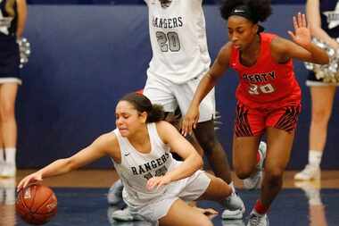 Lone Star guard Kyla Deck (14) dives for a loose ball in front of Liberty guard Jazzy...