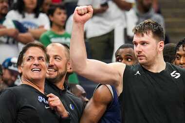 Dallas Mavericks minority owner Mark Cuban and guard Luka Doncic celebrate in the final...