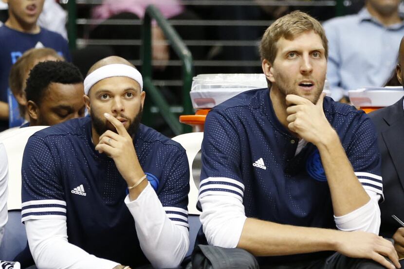 Dallas Mavericks guard Deron Williams (8) and Dallas Mavericks forward Dirk Nowitzki (41)...