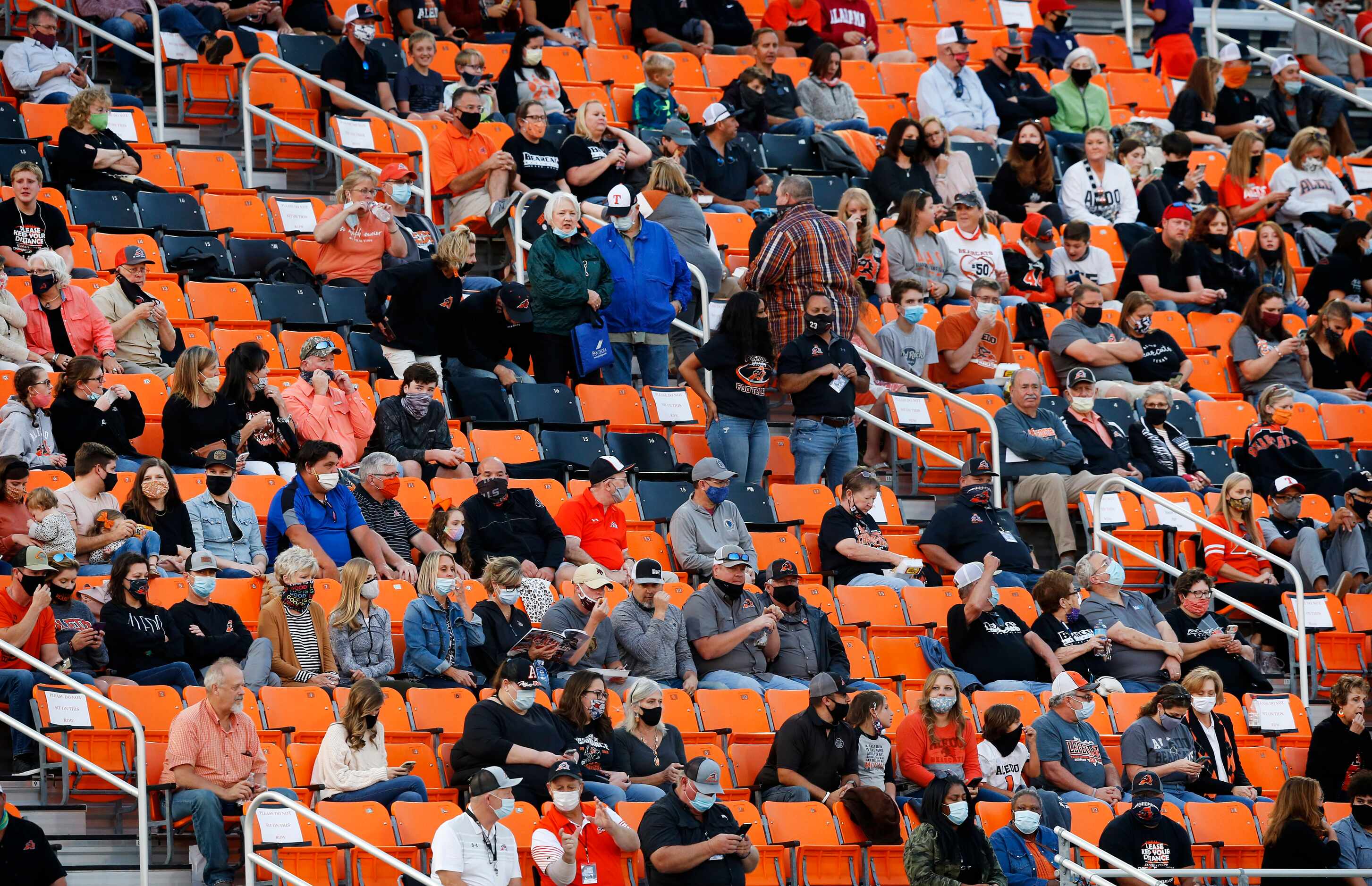 Aledo fans masked up and socially distanced in the stands before their team faced Frisco...