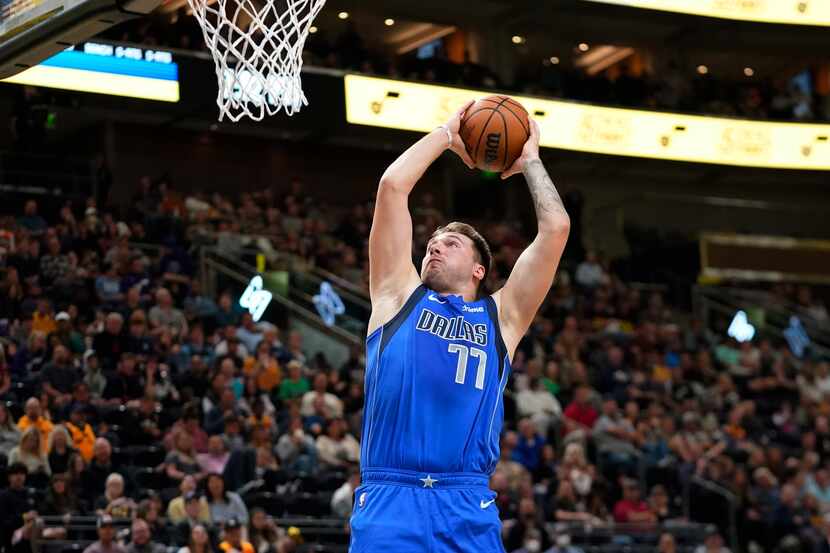 Dallas Mavericks guard Luka Doncic goes up for a dunk against the Utah Jazz during the first...