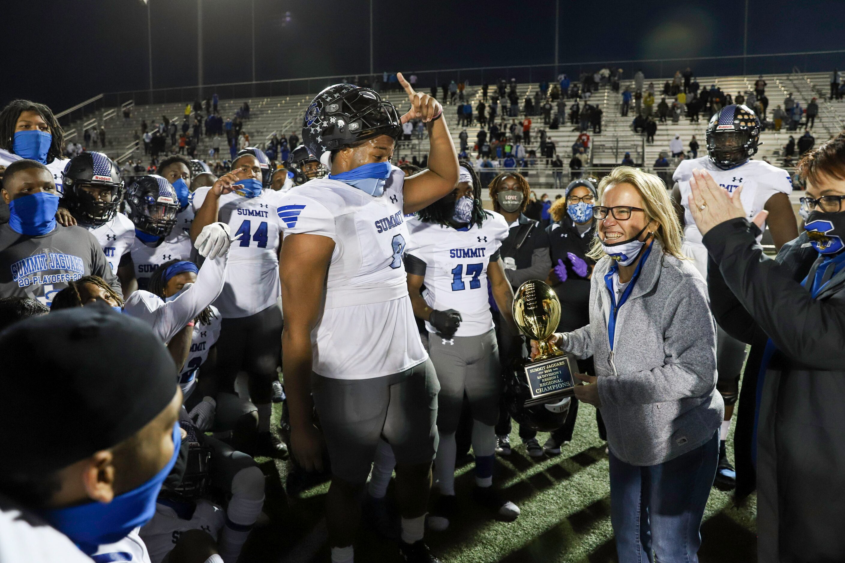 Mansfield assistant athletic director Tammy Lusinger presents the Class 5A Division I Region...