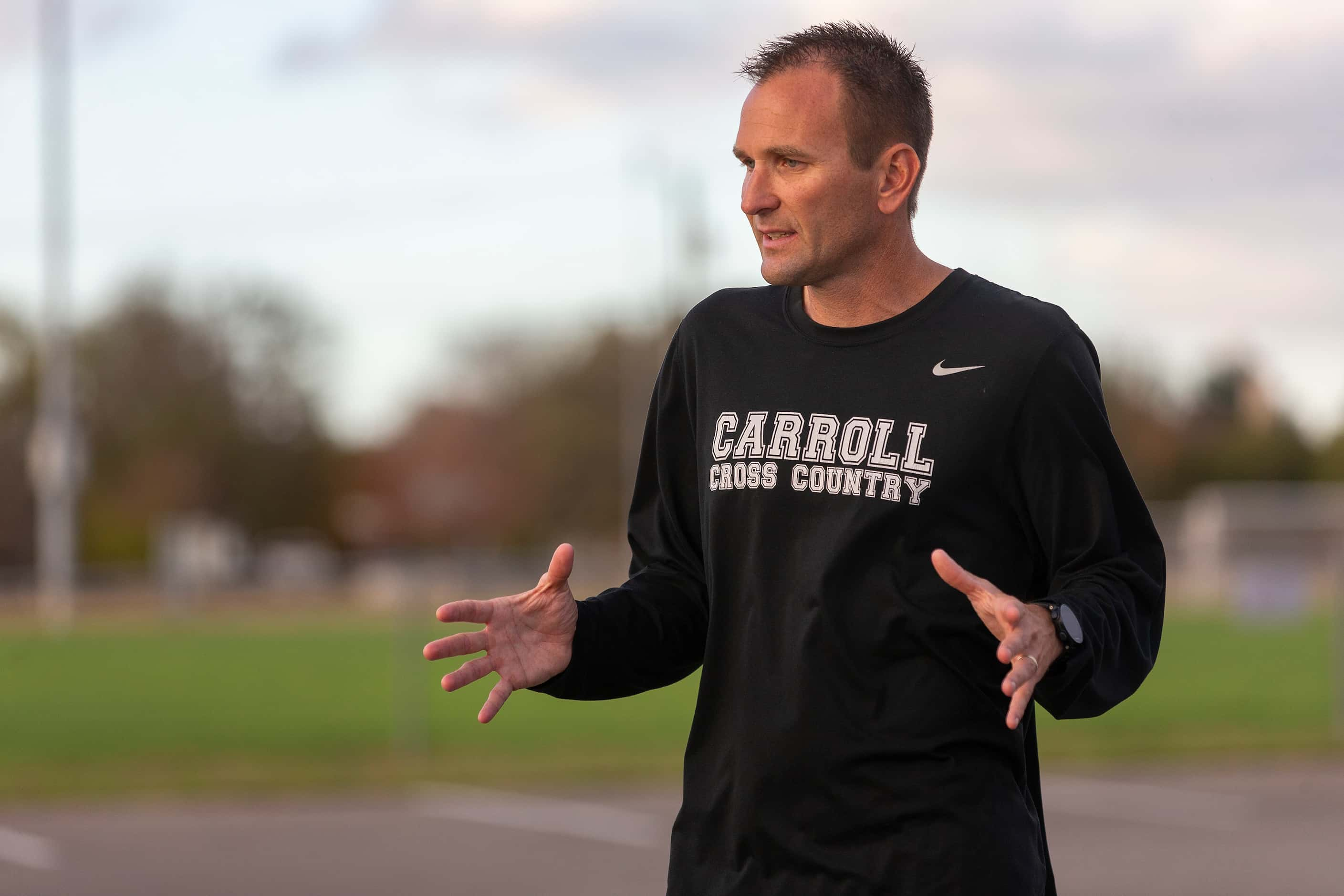 Southlake Carroll coach Justin Leonard speaks with his girls and boys team after finishing...