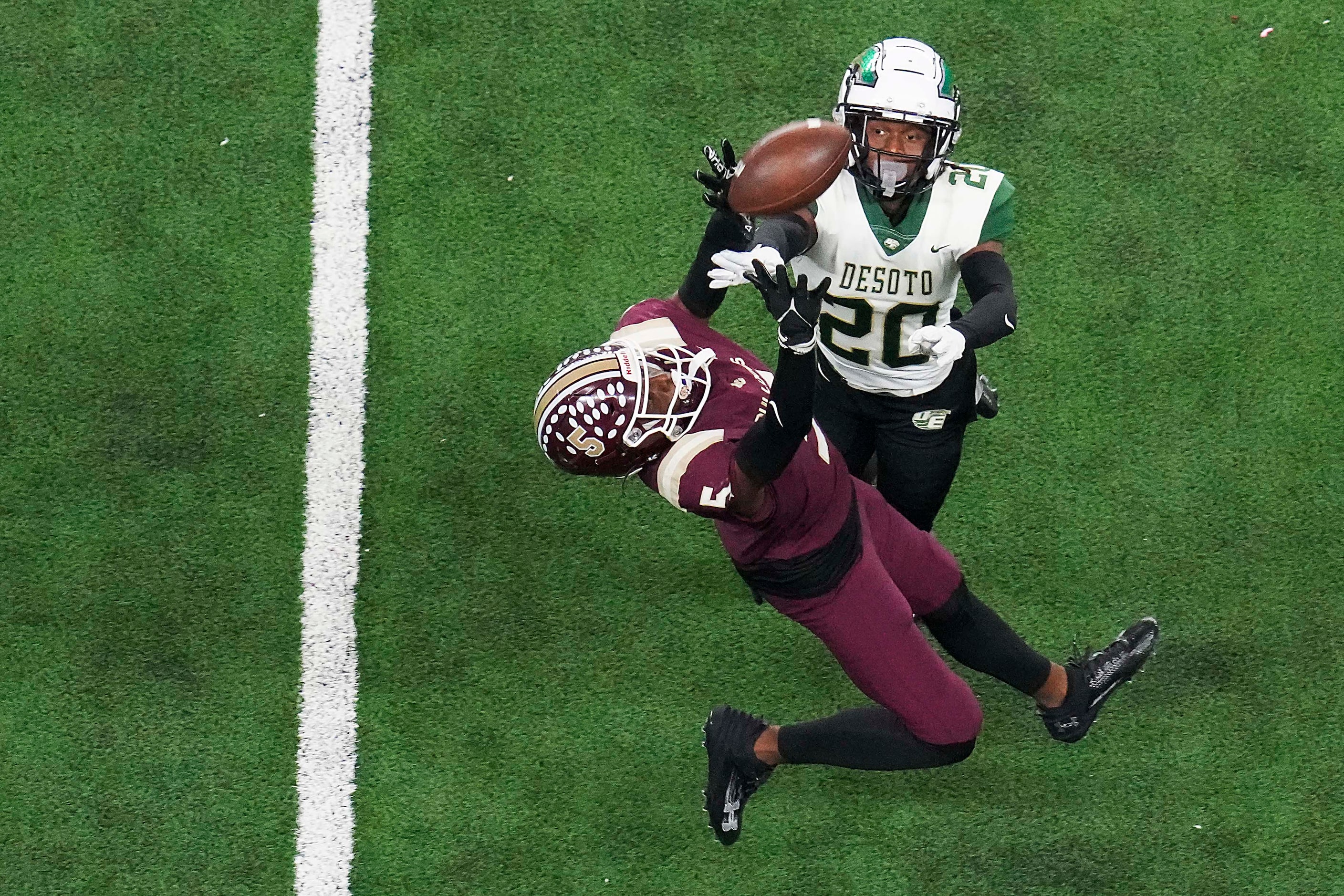 DeSoto defensive back Akeem Rahsaan (20) breaks up a pass intended for Humble Summer Creek...