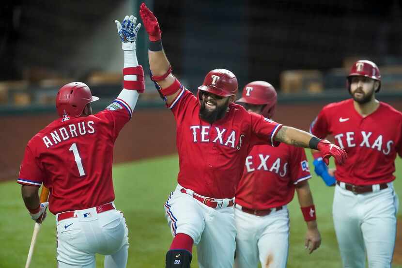 Texas Rangers second baseman Rougned Odor celebrates with shortstop Elvis Andrus after...