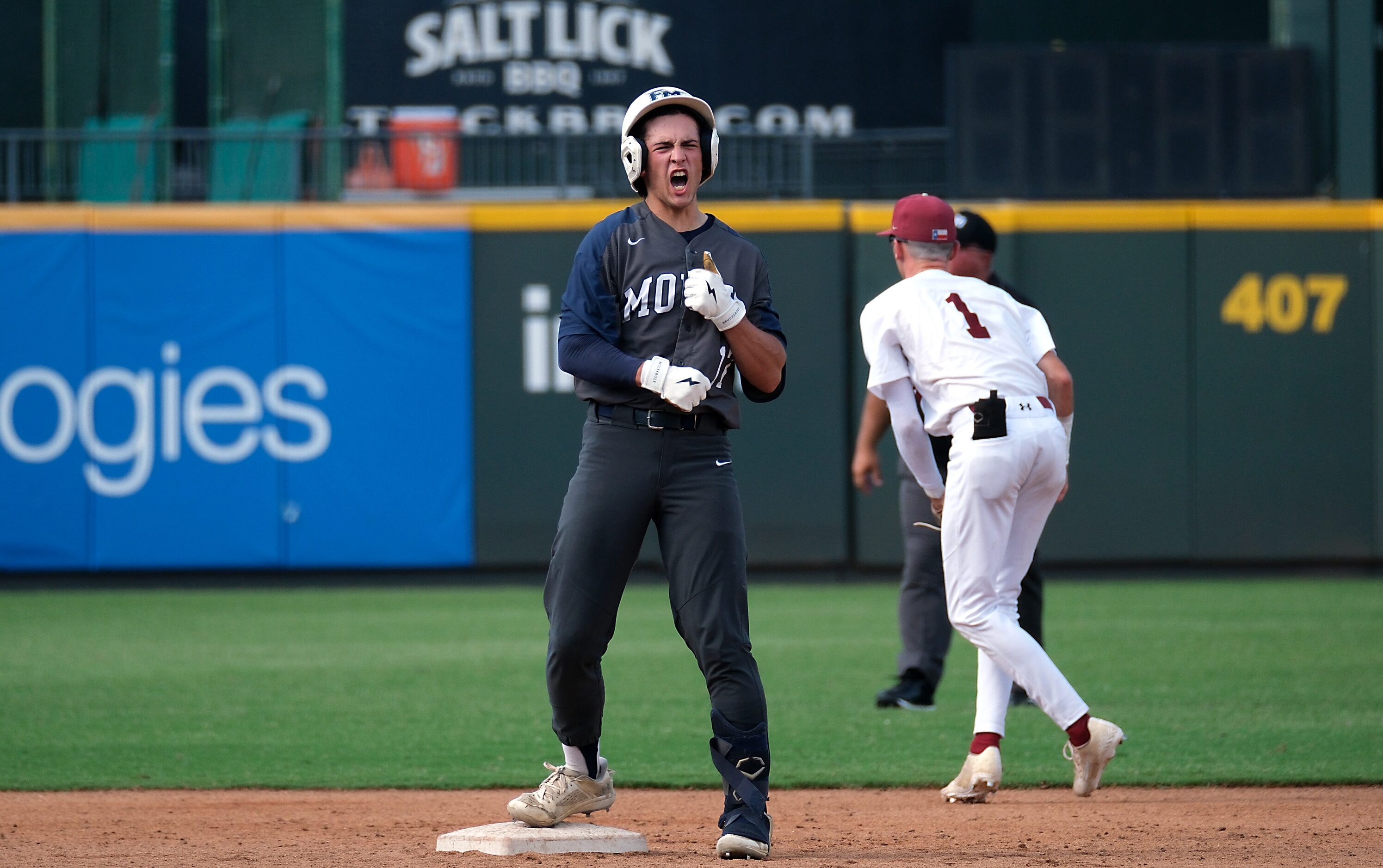 Flower Mound Zane Becker, (17), celebrates a double against Cypress Woods during the third...