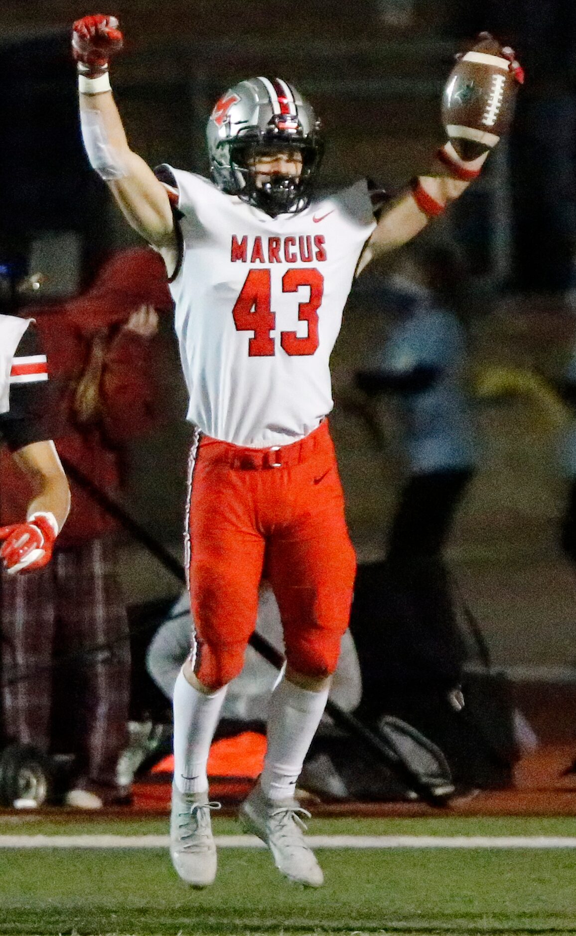 Flower Mound Marcus linebacker Mark Vassar (43) celebrates his interception returned for a...