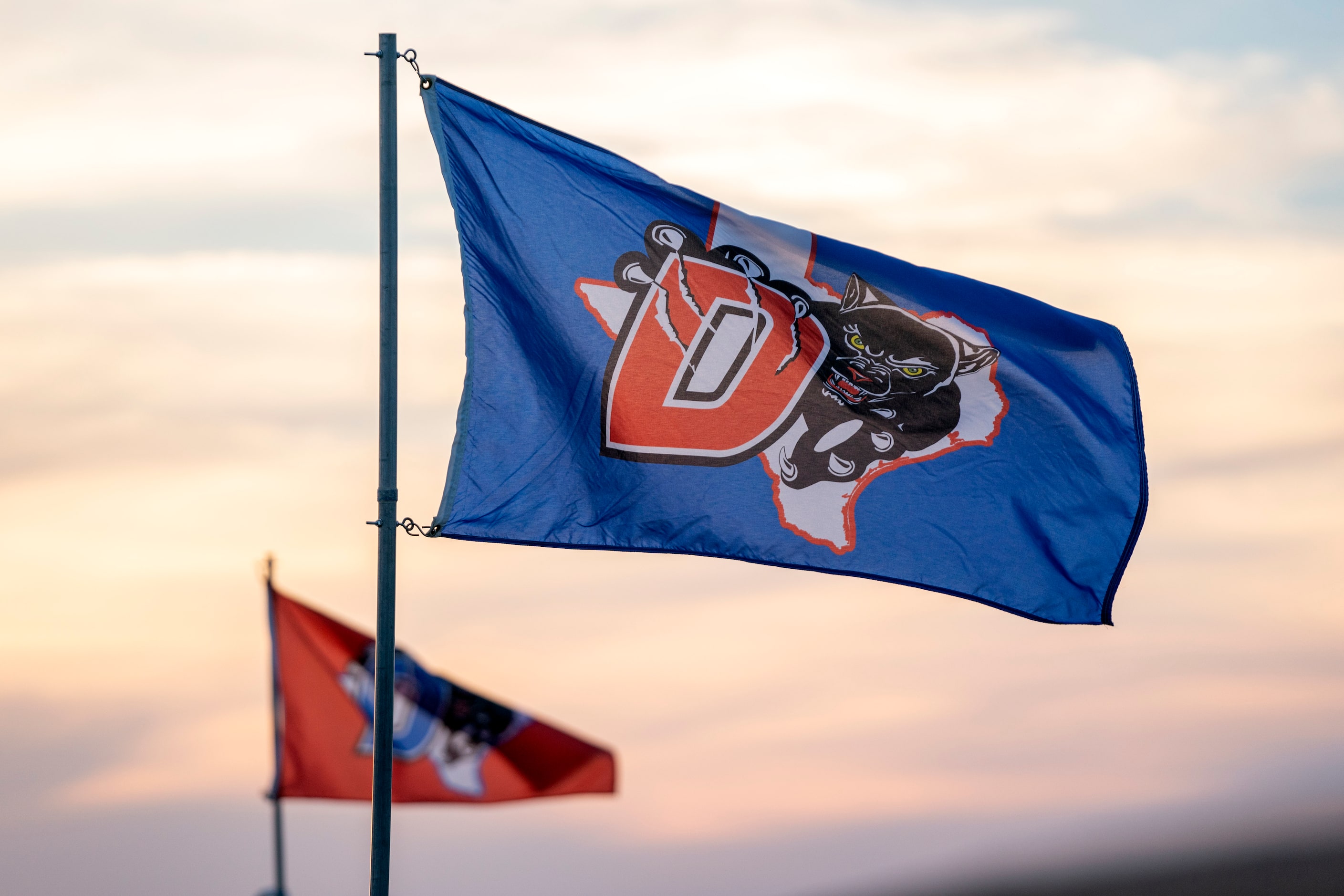 Duncanville flags fly over Panther Stadium before a high school football game against...