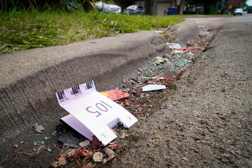 A crime scene evidence tent rests in the gutter near the scene of a shooting in the 8300...