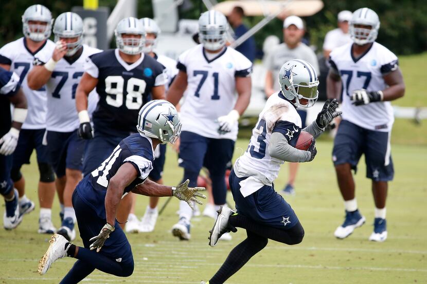 Dallas Cowboys wide receiver Terrance Williams (83) is chased by safety Byron Jones (31)...