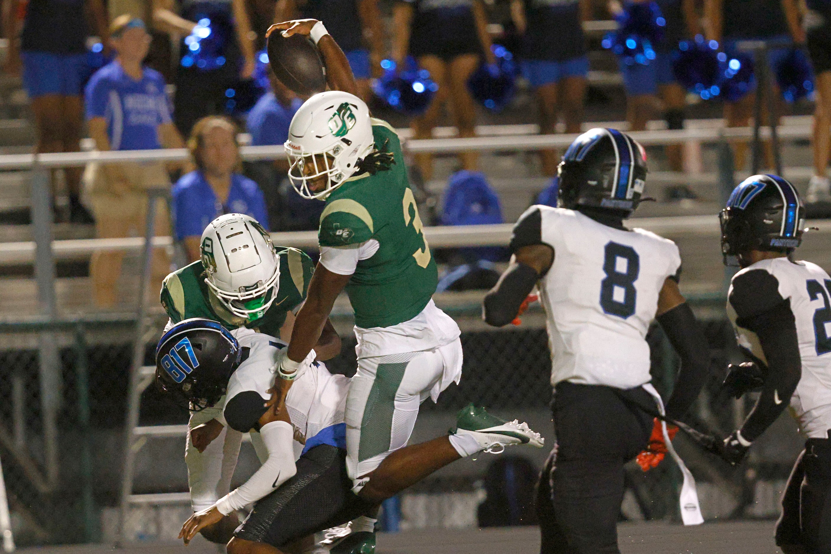 DeSoto's Kelden Ryan (3) scores a touchdown over North Crowley players during the first half...