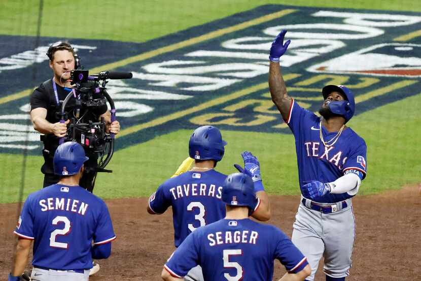 Texas Rangers Adolis Garcia (53) blows a kiss skyward after cranking a grand slam in the...