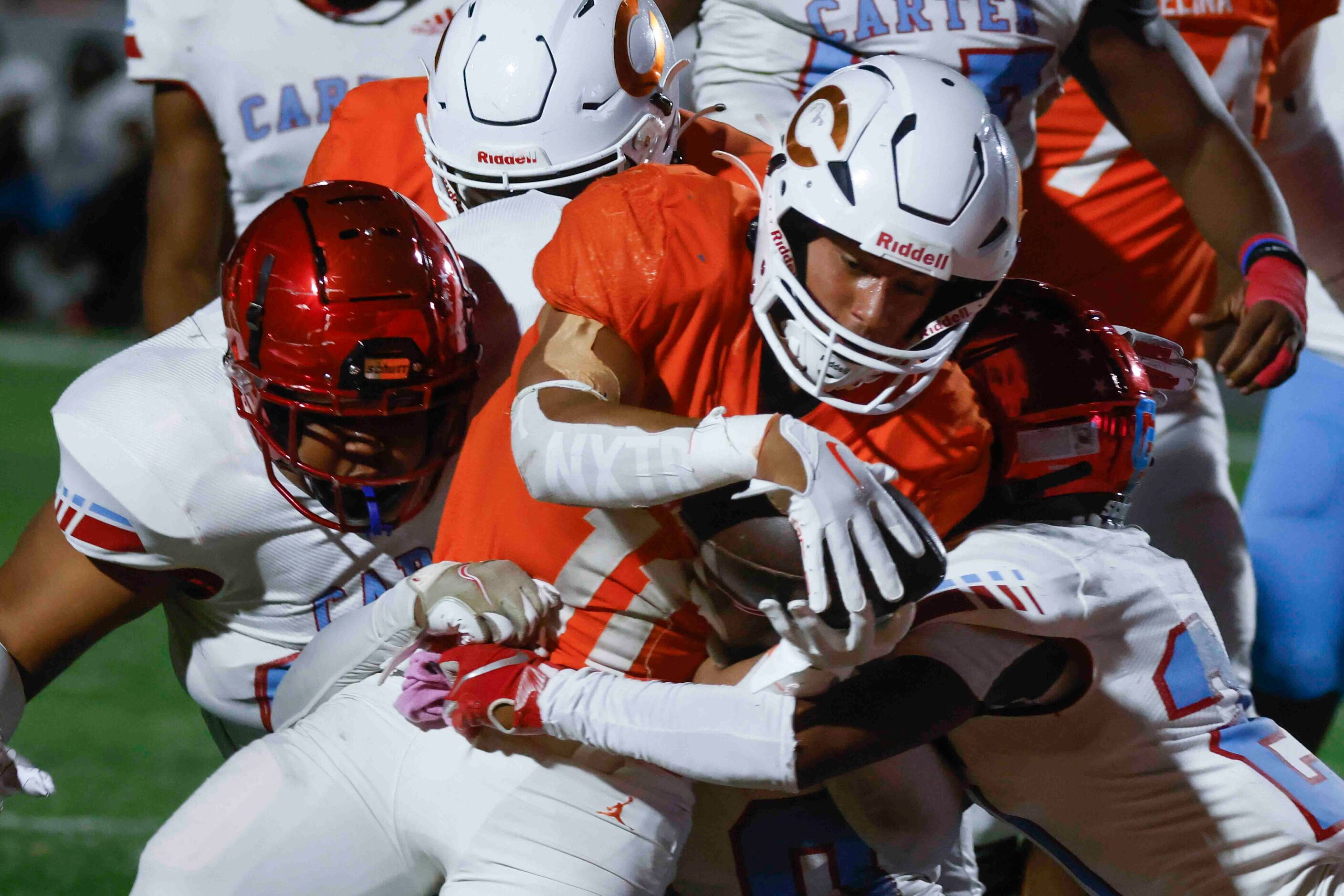 Celina High School’s Gabe Gayton (11) gets tackled ahead of a touchdown during the first...