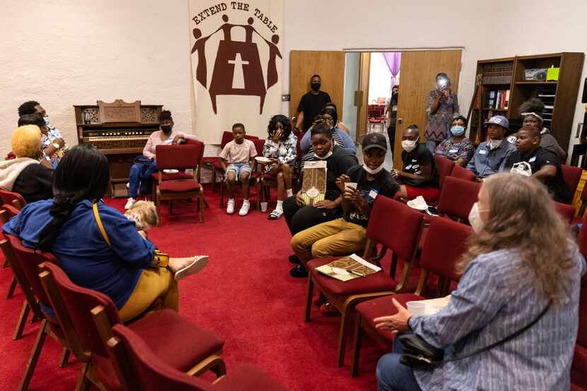 Attendees of a summit for Mesquite renters gather in a separate room with Texas Tenants...