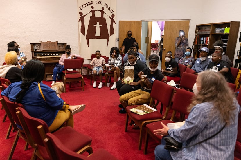 Attendees of a summit for Mesquite renters gather in a separate room with Texas Tenants...