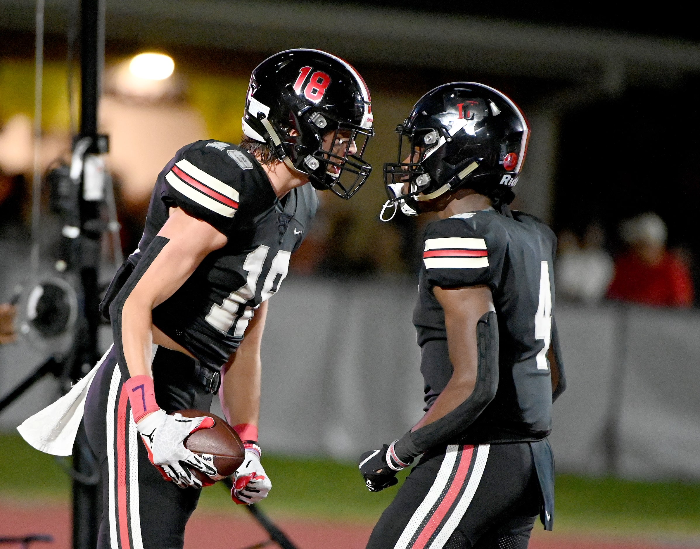 Lovejoy's Parker Livingstone (18) celebrates with Kyle Parker (4) after Livingstone’s...