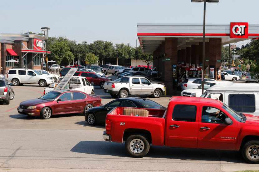 Motorist wait in line to purchase gas at Quik Trip located at 511 South Zang Blvd in Dallas...