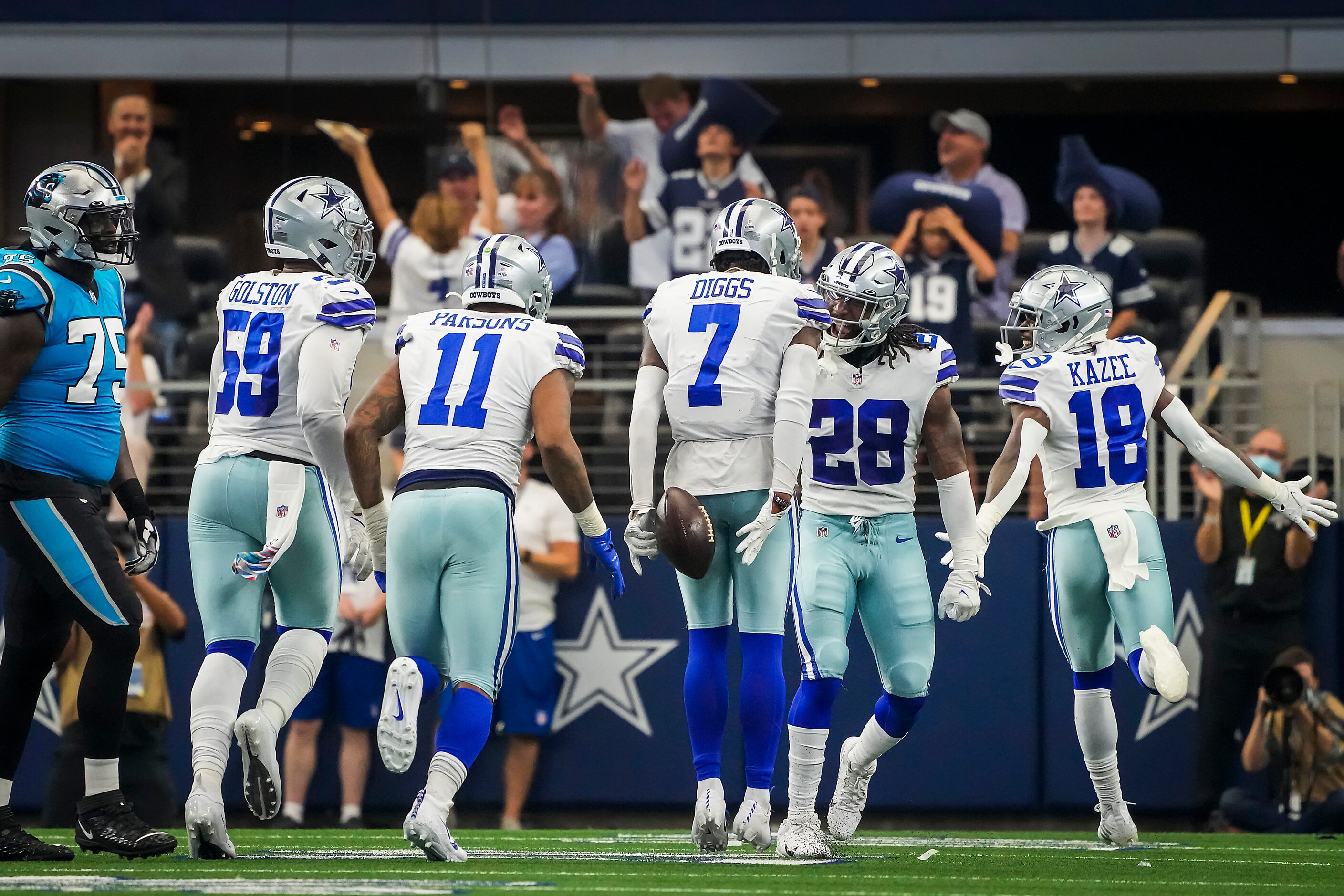 Dallas Cowboys cornerback Trevon Diggs (7) celebrates with defensive end Chauncey Golston...