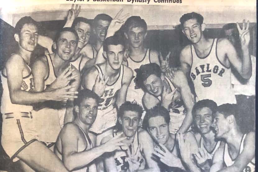 The 1950 Baylor men's basketball team celebrates after winning its third consecutive...