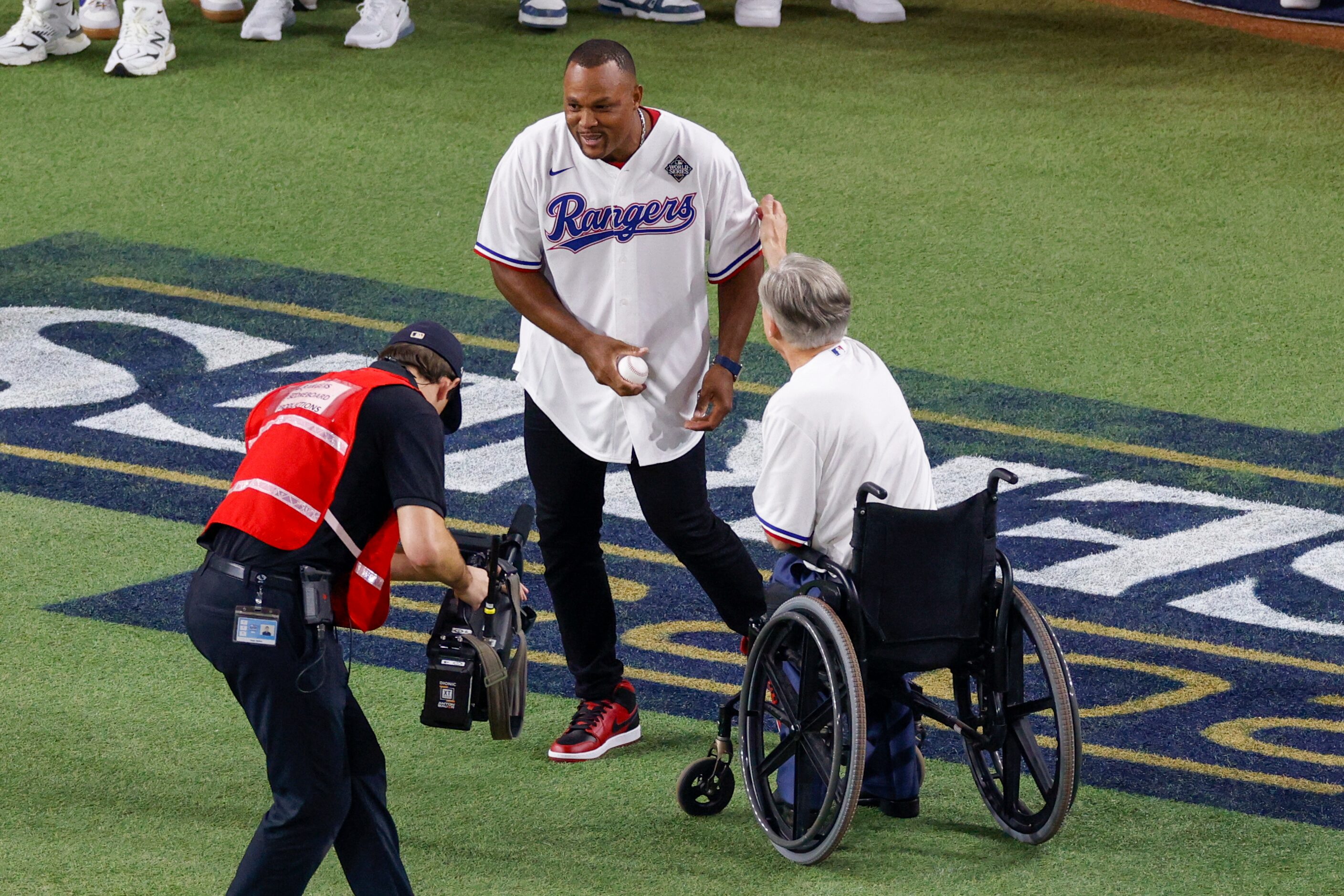 Former Texas Rangers third baseman Adrián Beltré greets Gov. Greg Abbott before the...