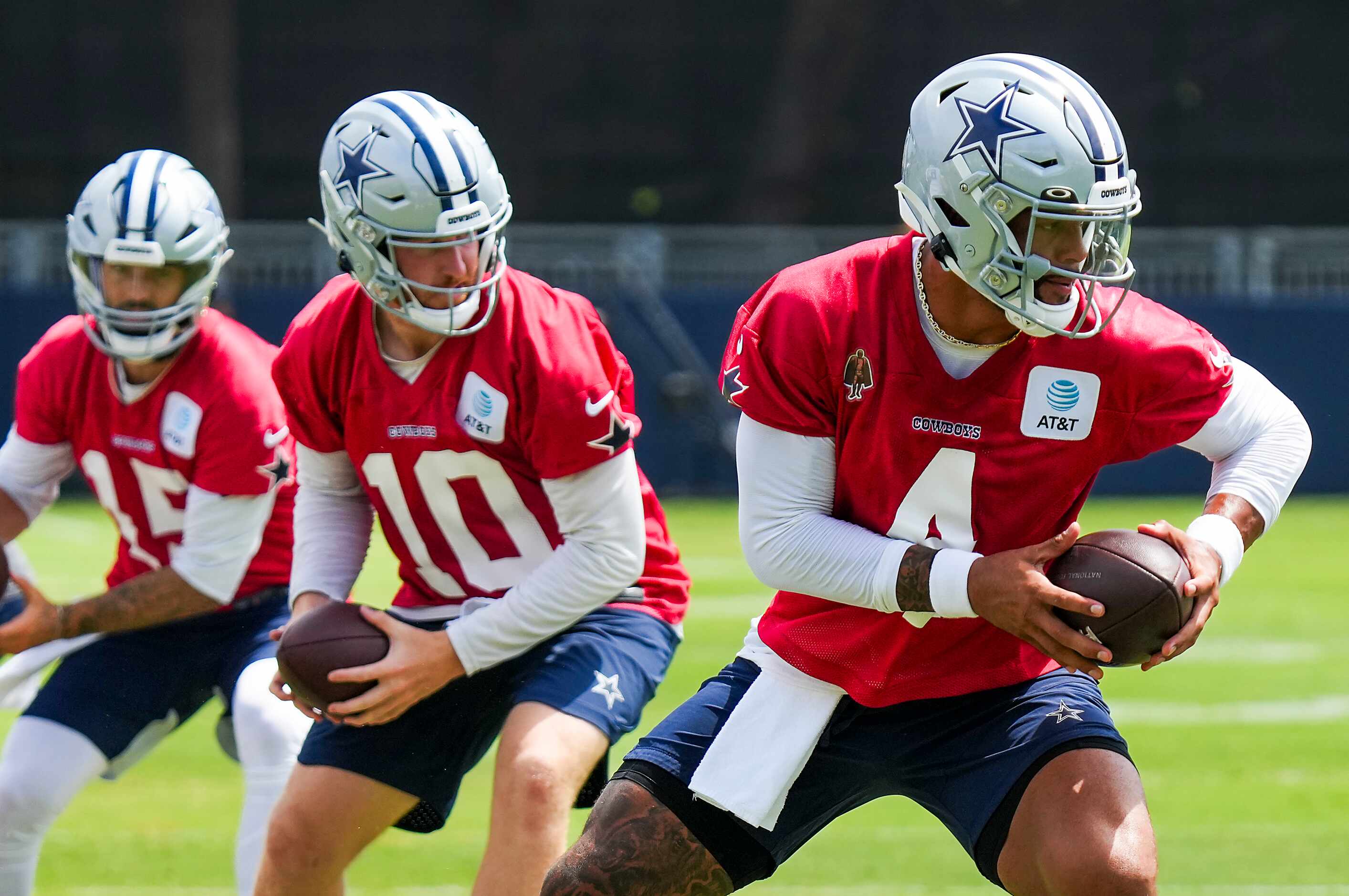 Dallas Cowboys quarterbacks Dak Prescott (4), Cooper Rush (10) and Will Grier (15)...