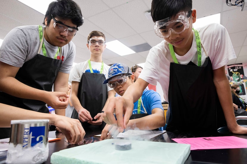 Pierce Nguyen tries to levitate a magnet.