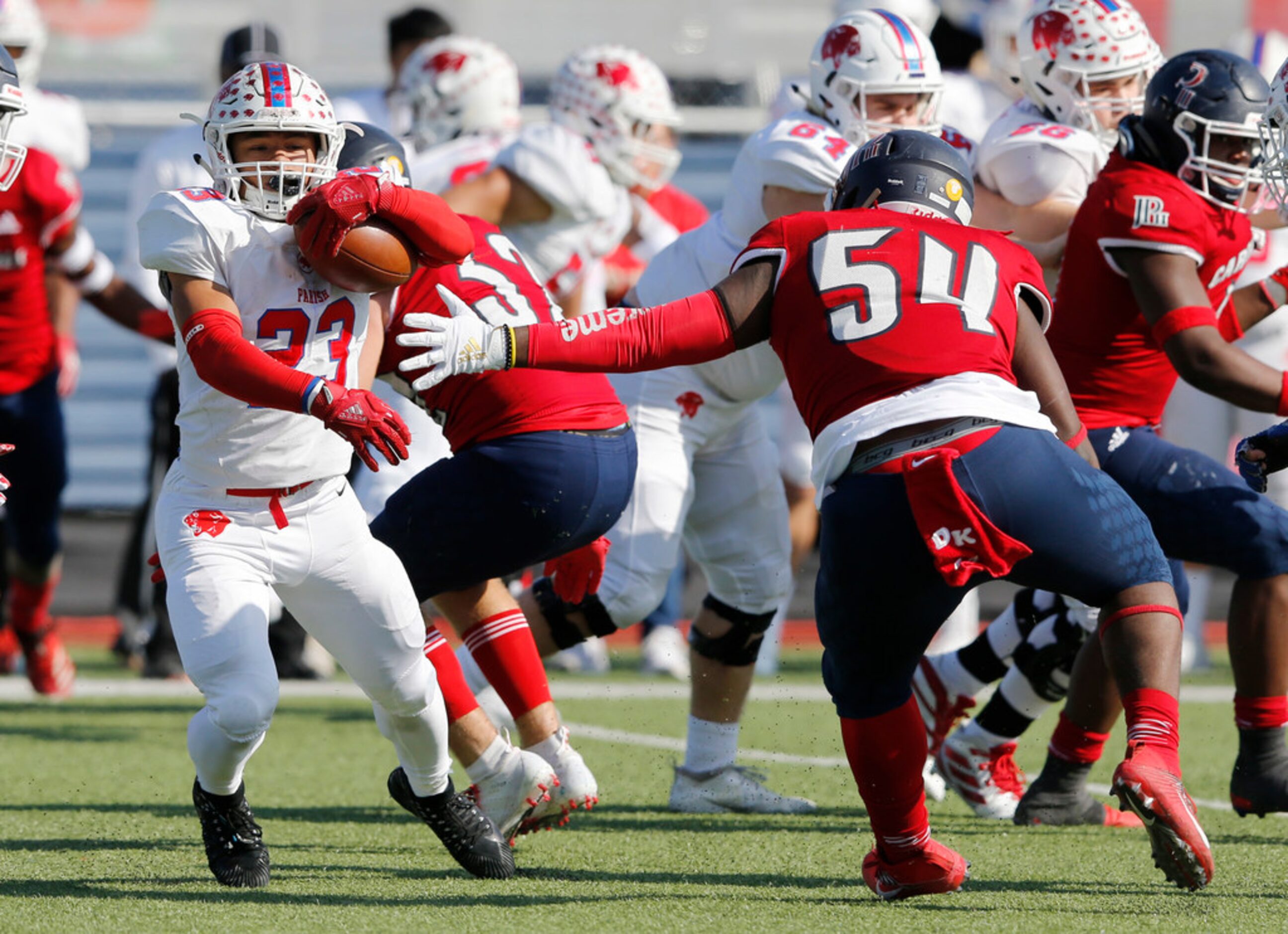 Parish Episcopal's Christian Benson (23) slides by Plano John Paul II's Dylan Harris (54)...