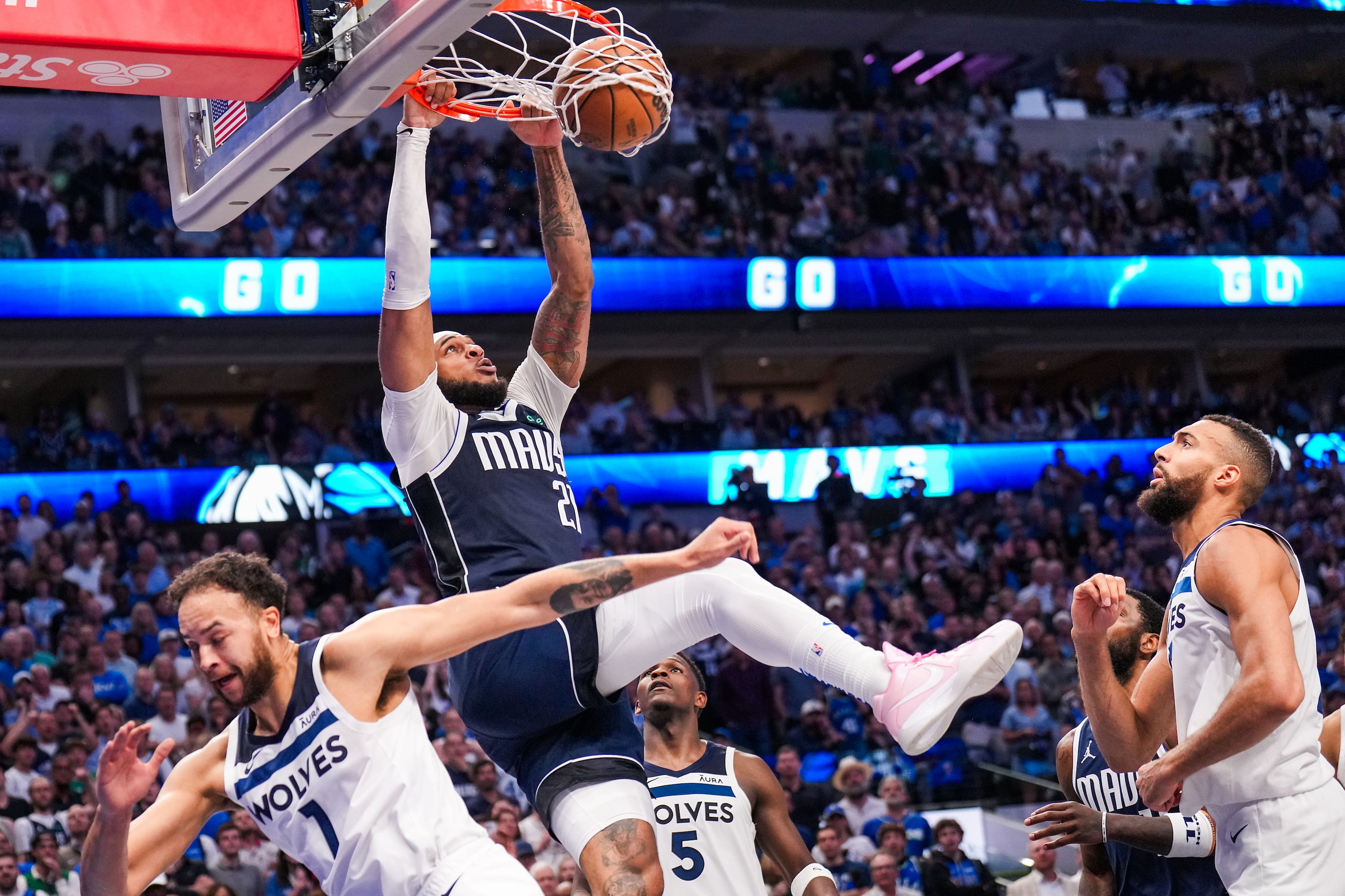 Dallas Mavericks center Daniel Gafford (21) dunks over Minnesota Timberwolves forward Kyle...