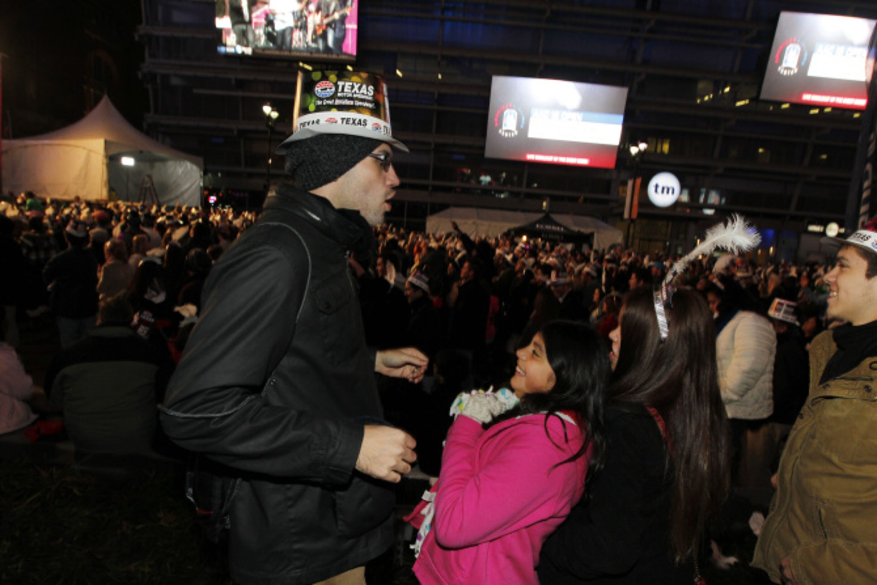 Emmanuel Crandell from Euless dances with his daughter Bethany Crandell, 9, during Big D New...