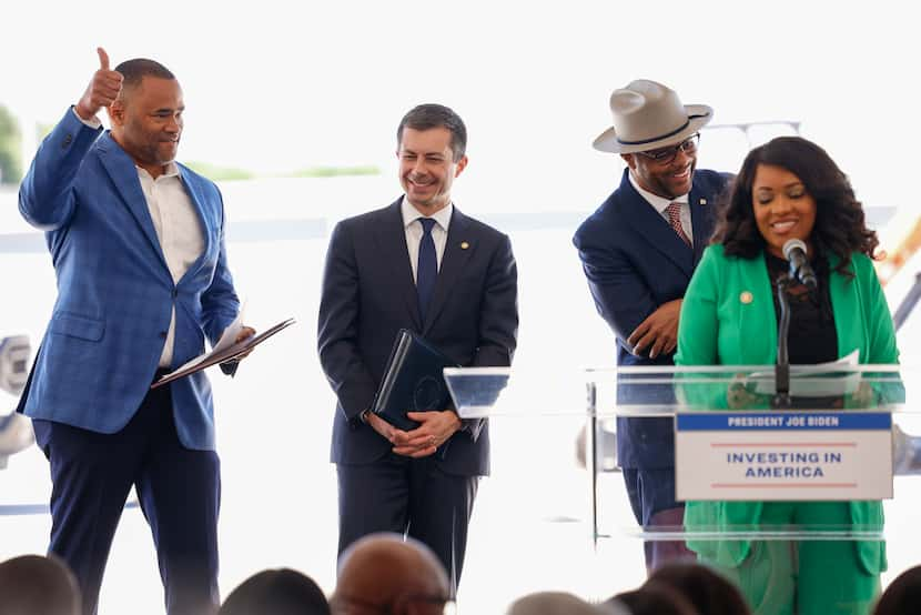 Rep. Marc Veasey gives a thumbs up alongside U.S. Transportation Secretary Pete Buttigieg...