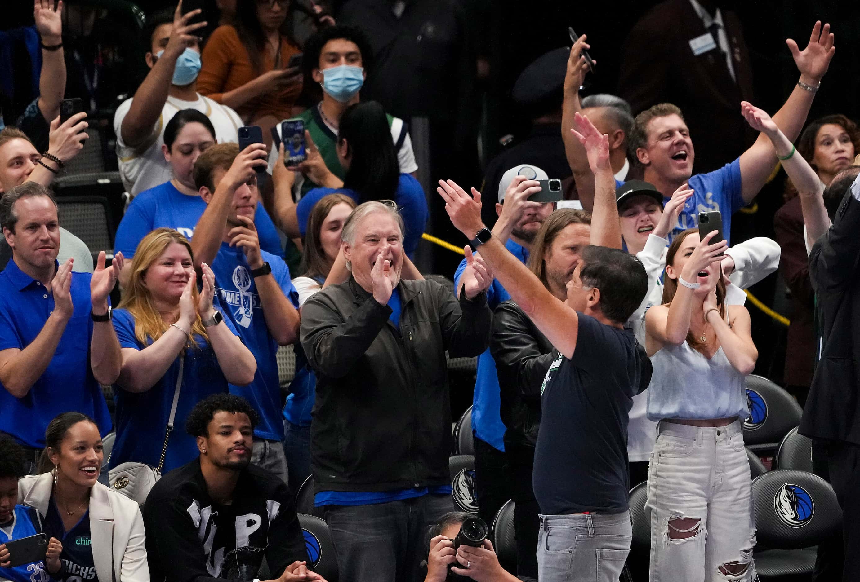Dallas Mavericks owner Mark Cuban celebrates with fans after a 113-86 win over the Phoenix...