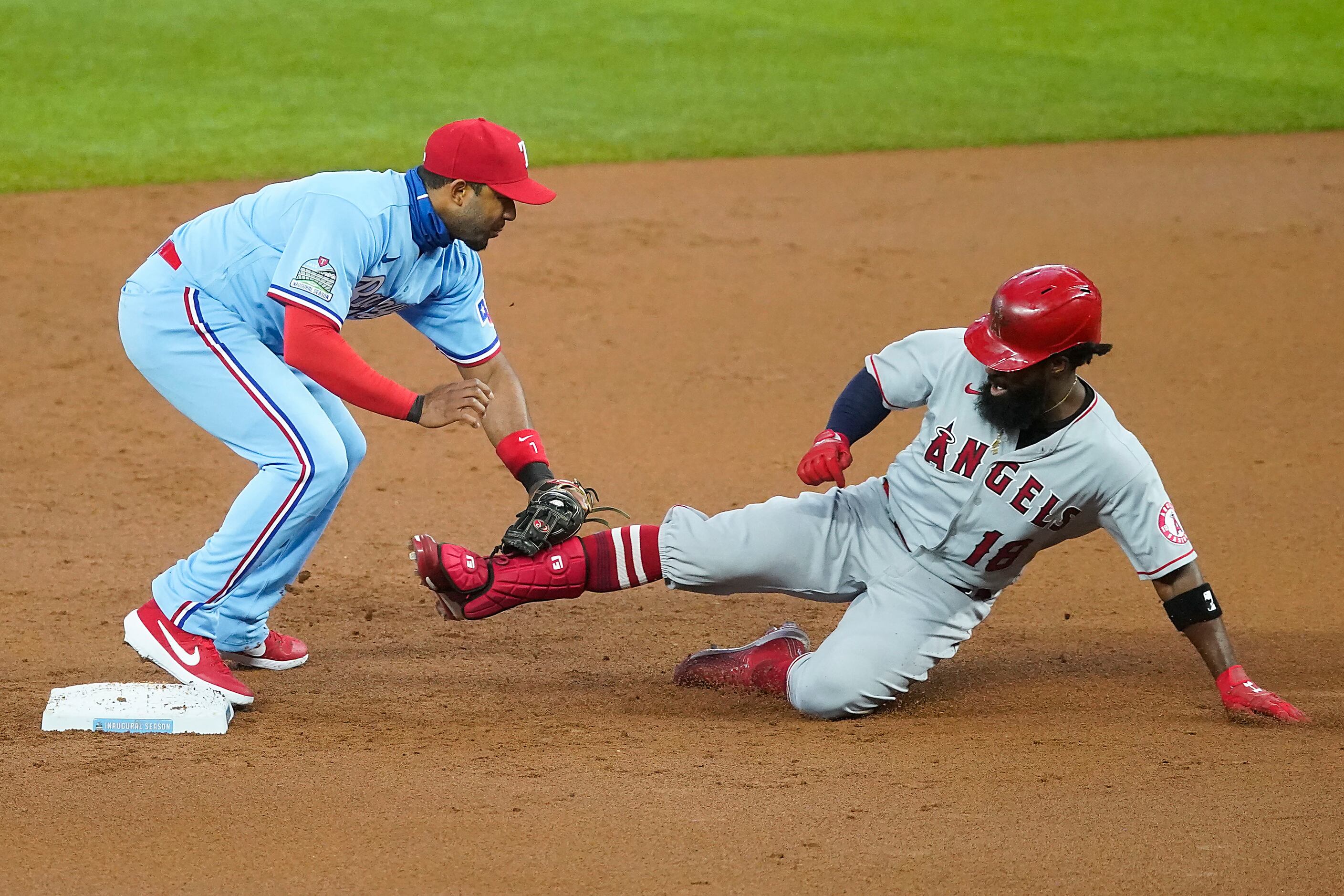 Los Angeles Angels outfielder Brian Goodwin is throw out trying to stretch a single into a...