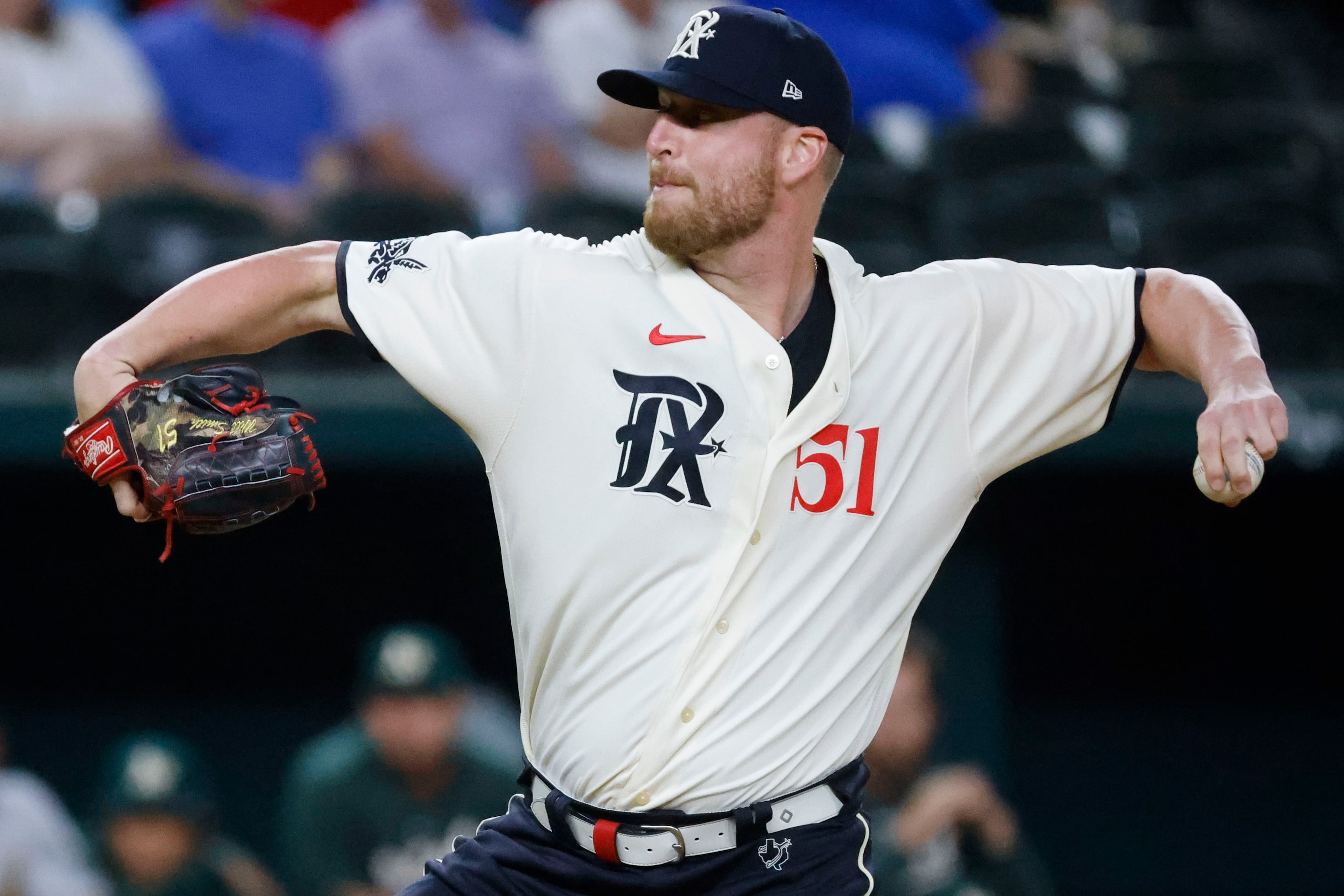 Texas Rangers relief pitcher Will Smith throws during the ninth inning of a baseball game...