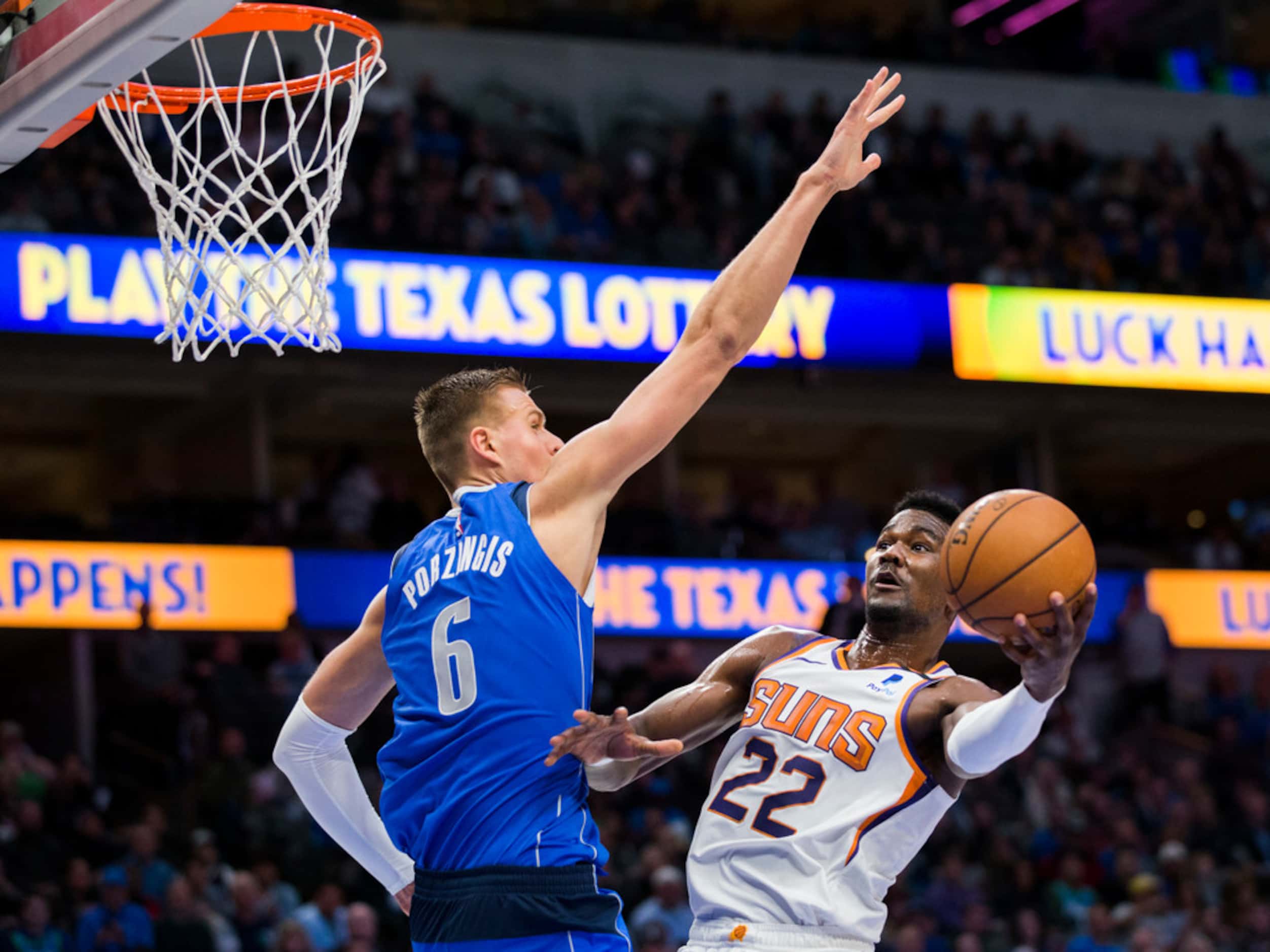 Dallas Mavericks forward Kristaps Porzingis (6) tries to block a shot by Phoenix Suns center...