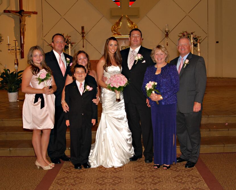  Pictured: The Grobe family, at son Ben (third from right)'s wedding in 2012. Jim, left,...