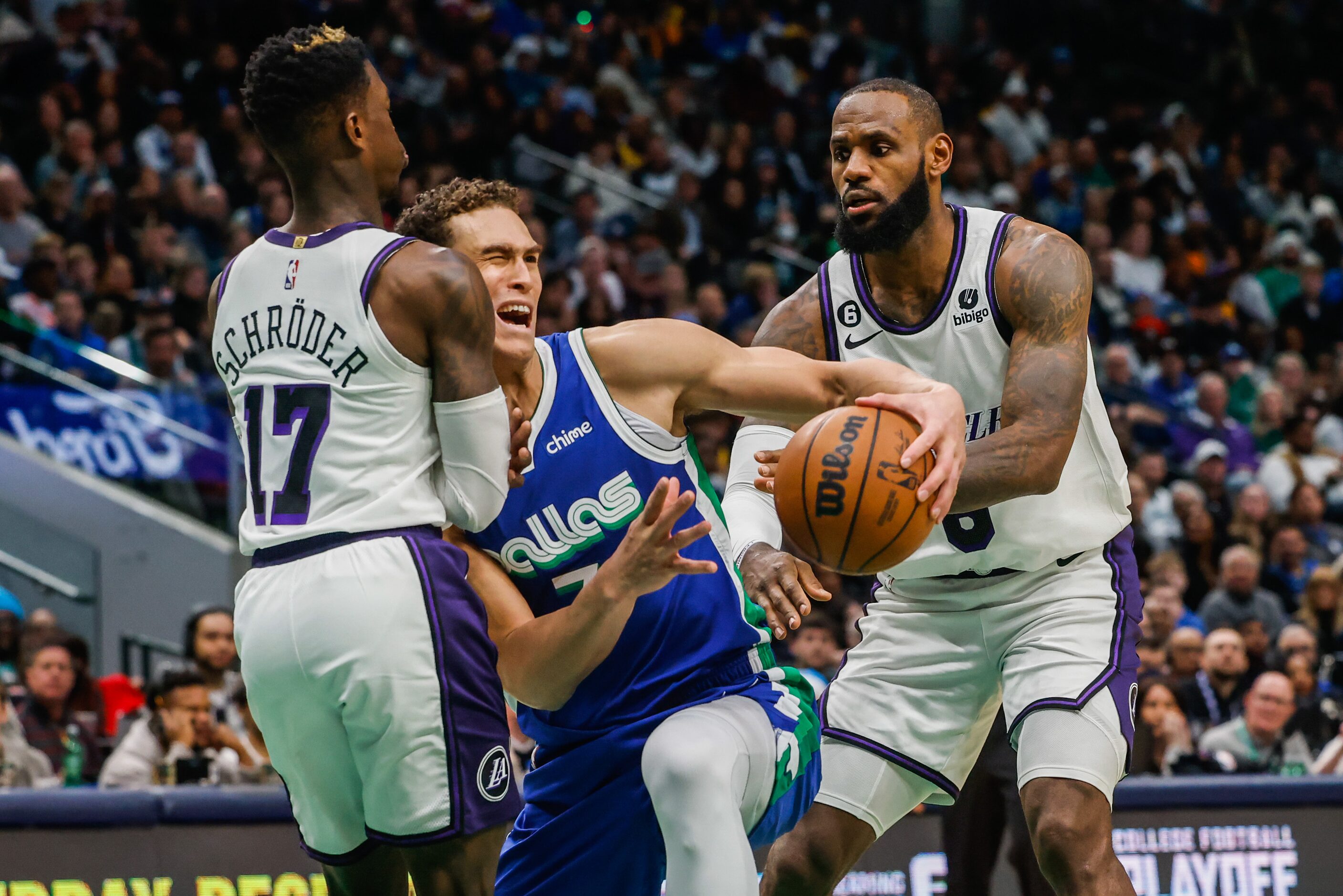 Dallas Mavericks center Dwight Powell (7) reacts as Los Angeles Lakers guard Dennis Schroder...