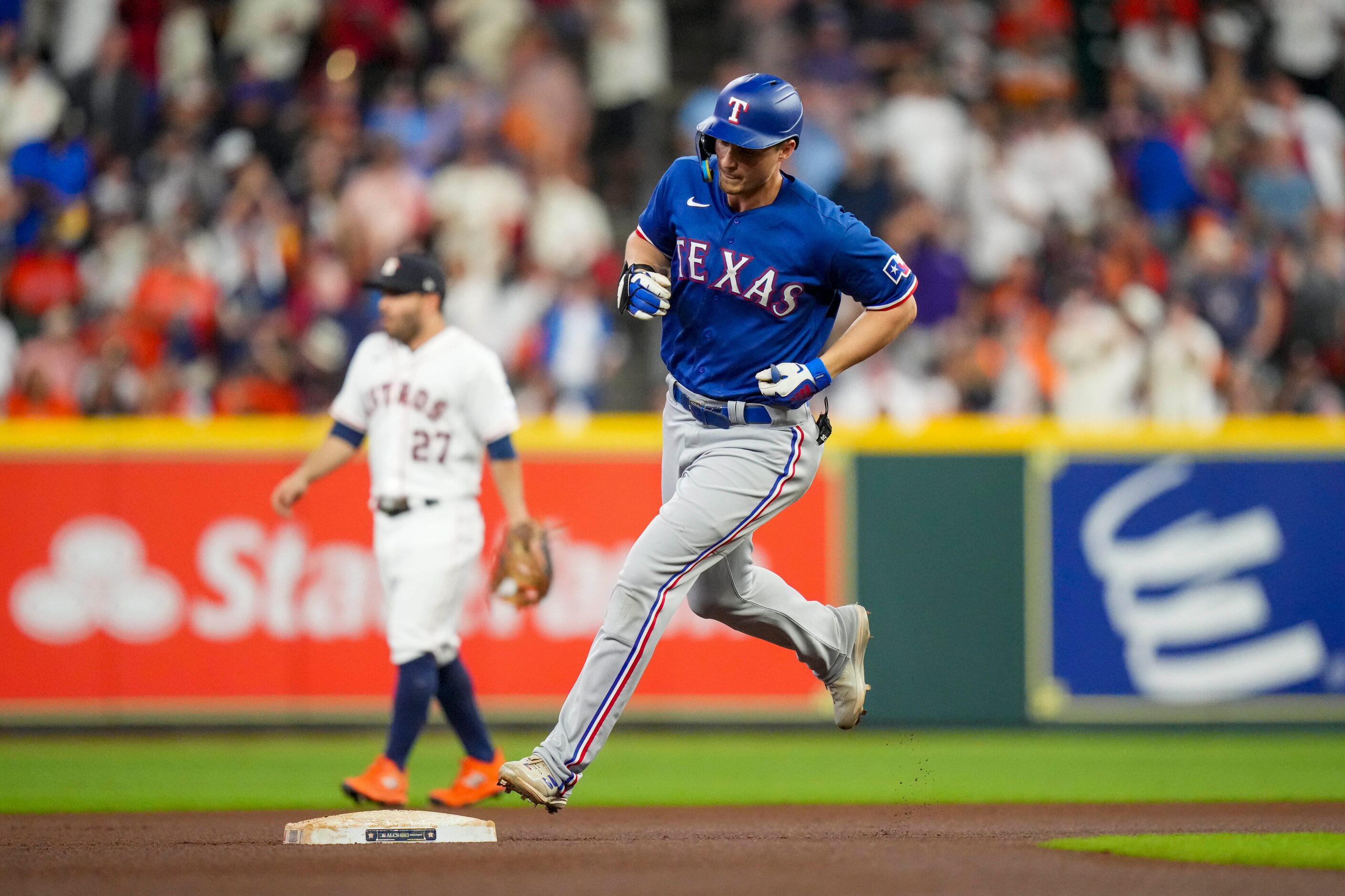 Texas Rangers shortstop Corey Seager (5) rounds the bases after hitting a solo home run...