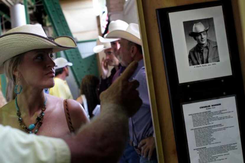 
Linda Harris, left, of Fort Worth looks at a display in the new Texas Rodeo Cowboy Hall of...