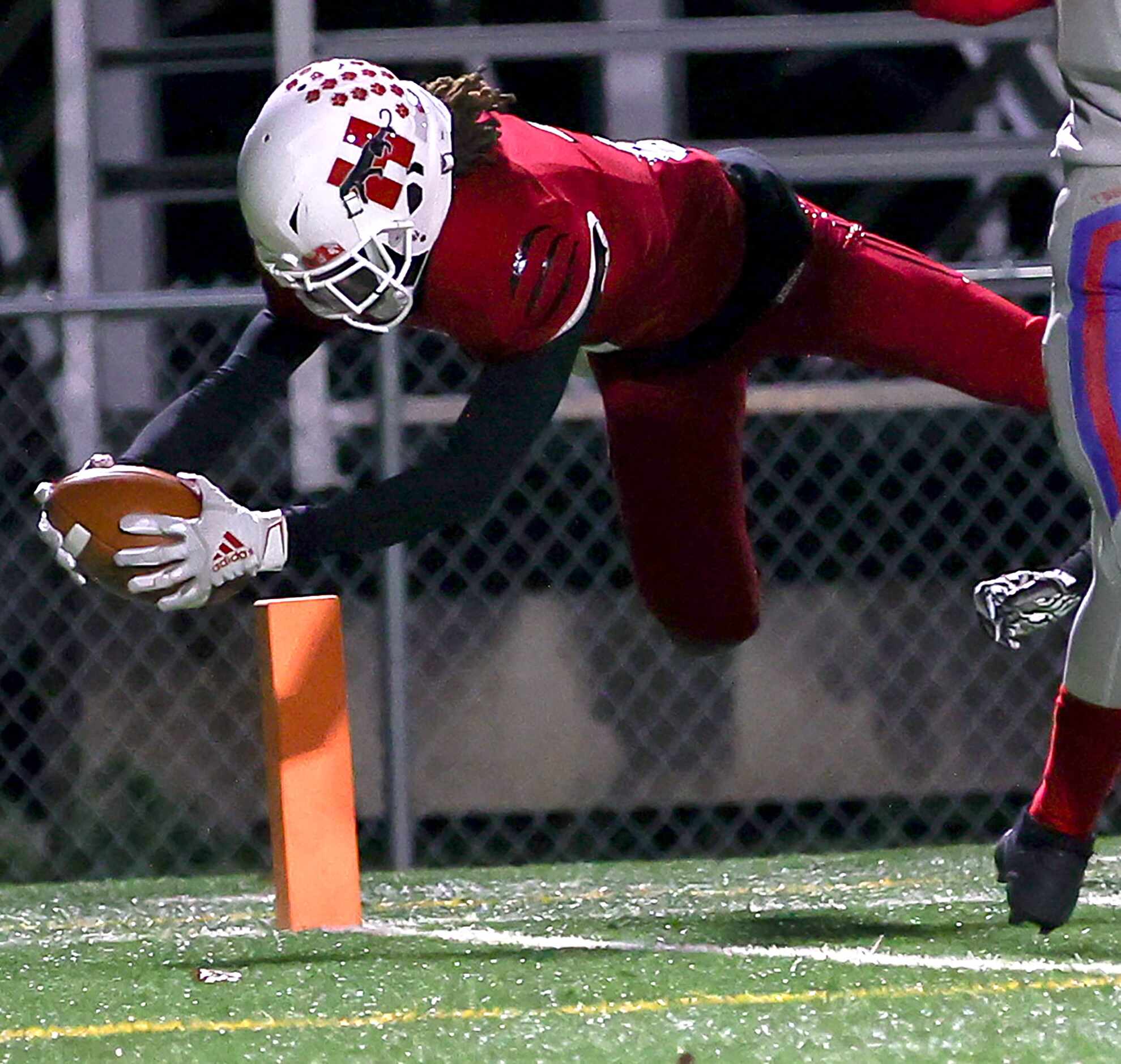 Hillcrest running back Reggie Williams dives into the endzone for a touchdown run against...
