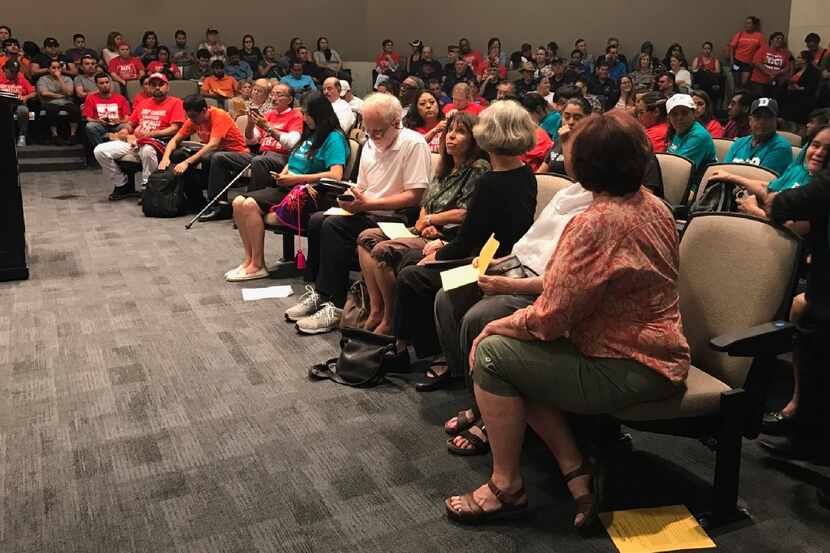 Carrollton residents and immigrant advocates gathered at Carrollton City Hall in July to...