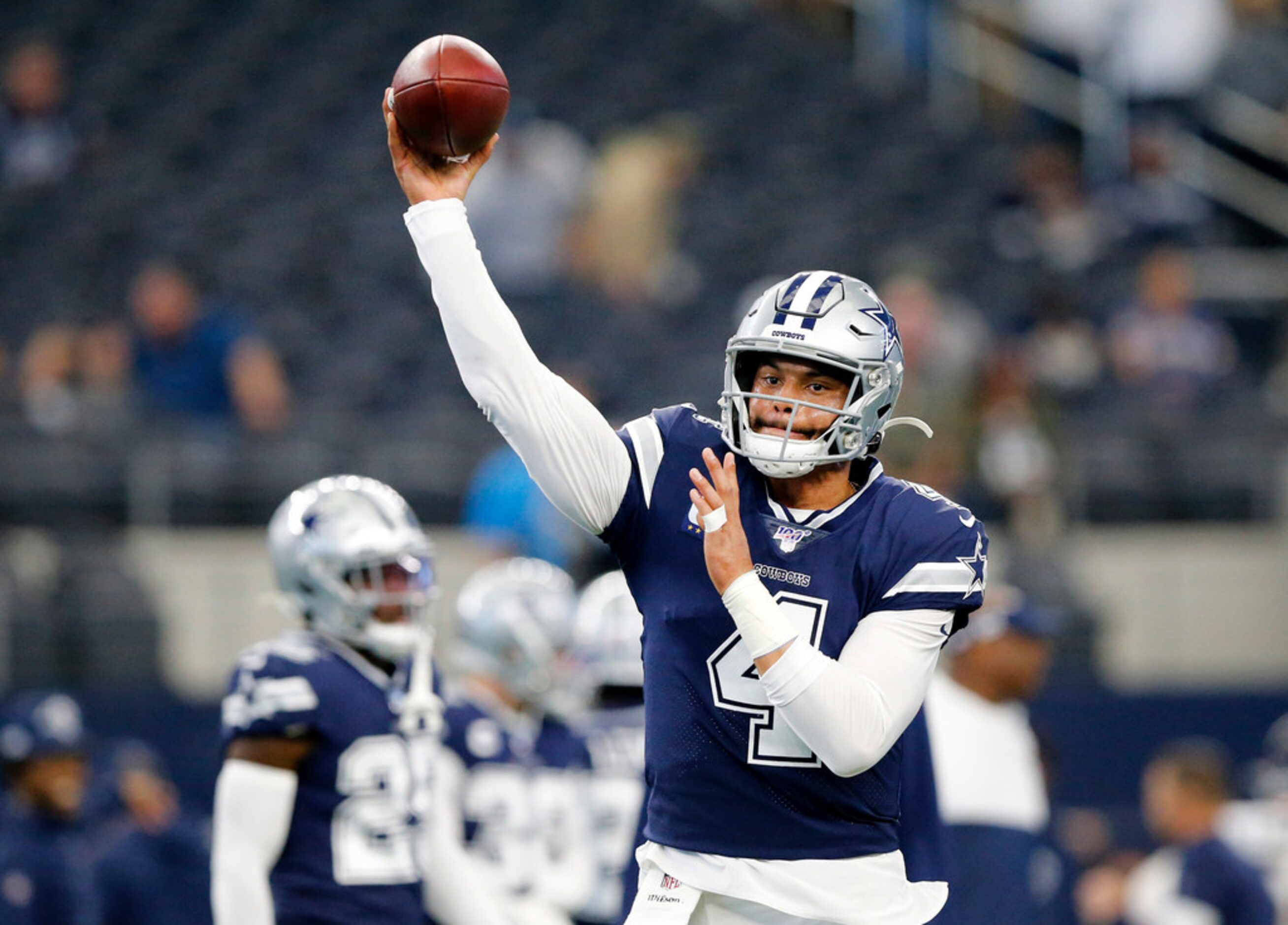 Dallas Cowboys quarterback Dak Prescott (4) throws during pregame warmups before facing the...