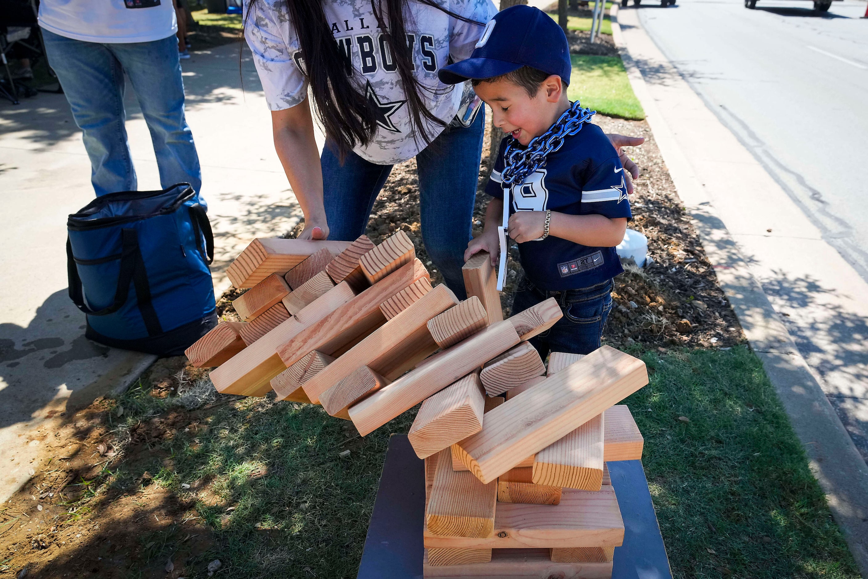 Dallas Cowboys fans tailgate before an NFL football game at AT&T Stadium against the New...