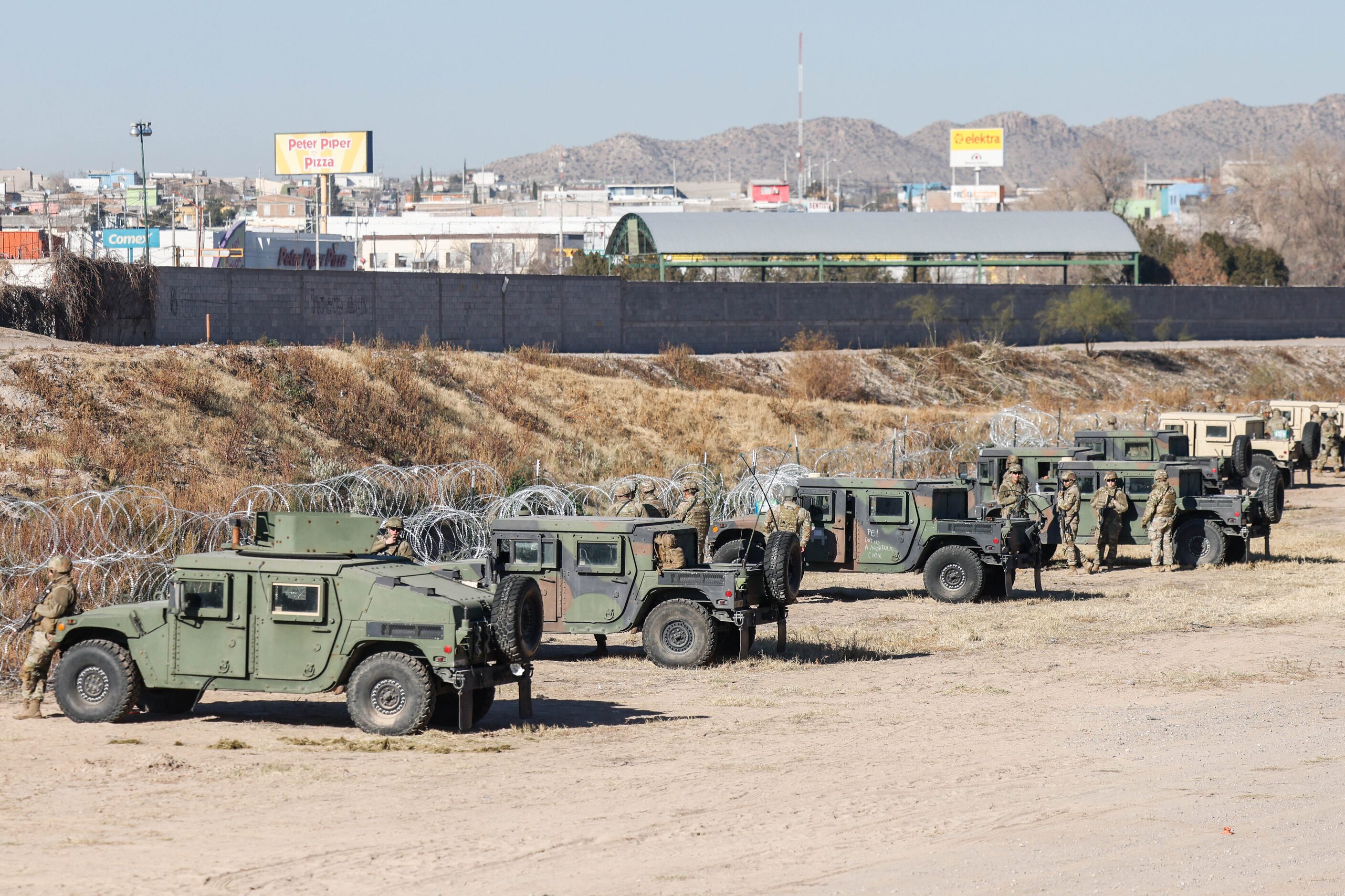 The Texas National Guard guards the US-Mexico border from the banks of the Rio Grande River...