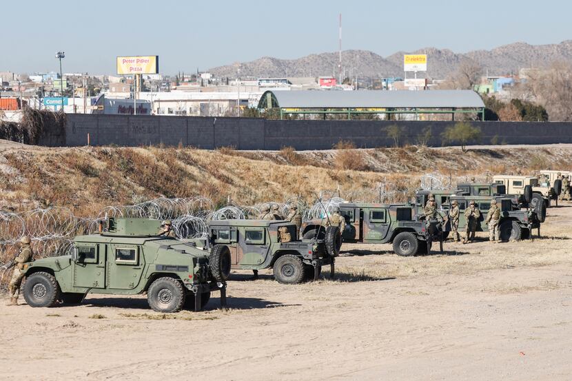 The Texas National Guard guards the U.S.-Mexico border from the banks of the Rio Grande...
