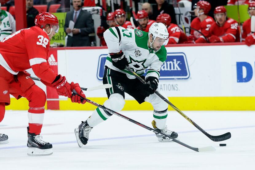 Dallas Stars center Devin Shore (17) is pursued down the ice by Detroit Red Wings right wing...