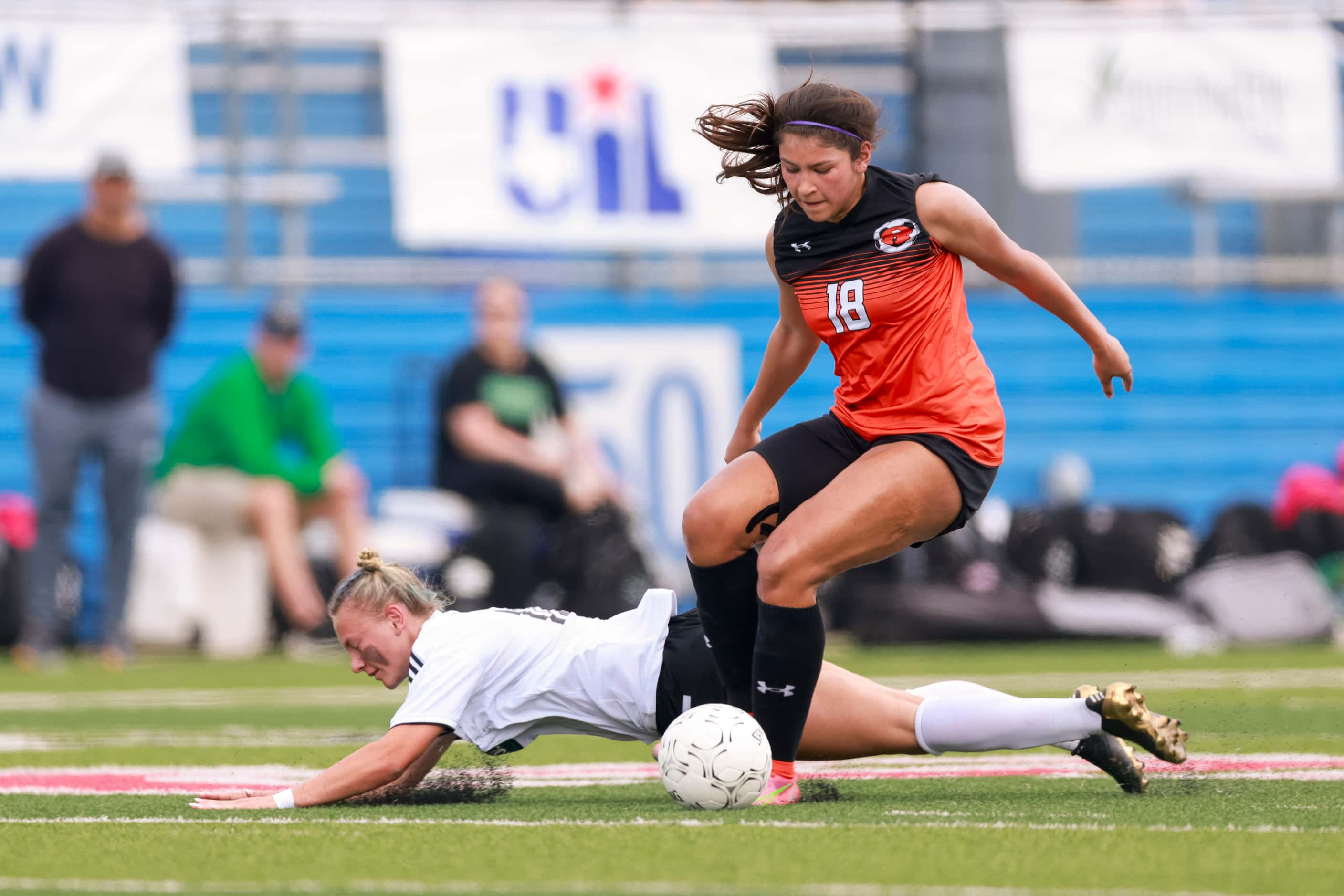 Southlake Carroll midfielder Kennedy Fuller (10) is fouled by Rockwall defender Mia Nunez...