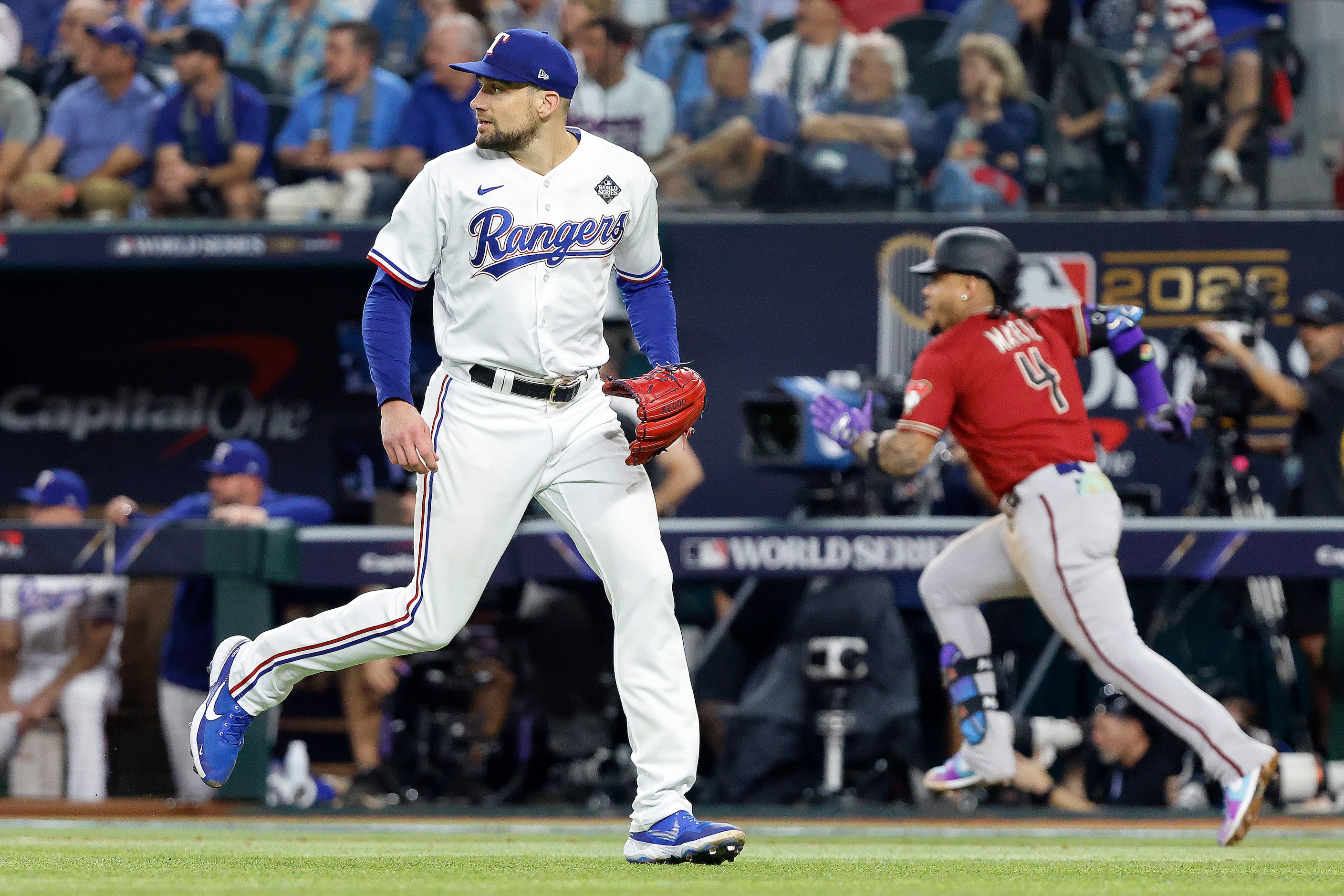 Texas Rangers starting pitcher Nathan Eovaldi moves to cover home plate after Arizona...