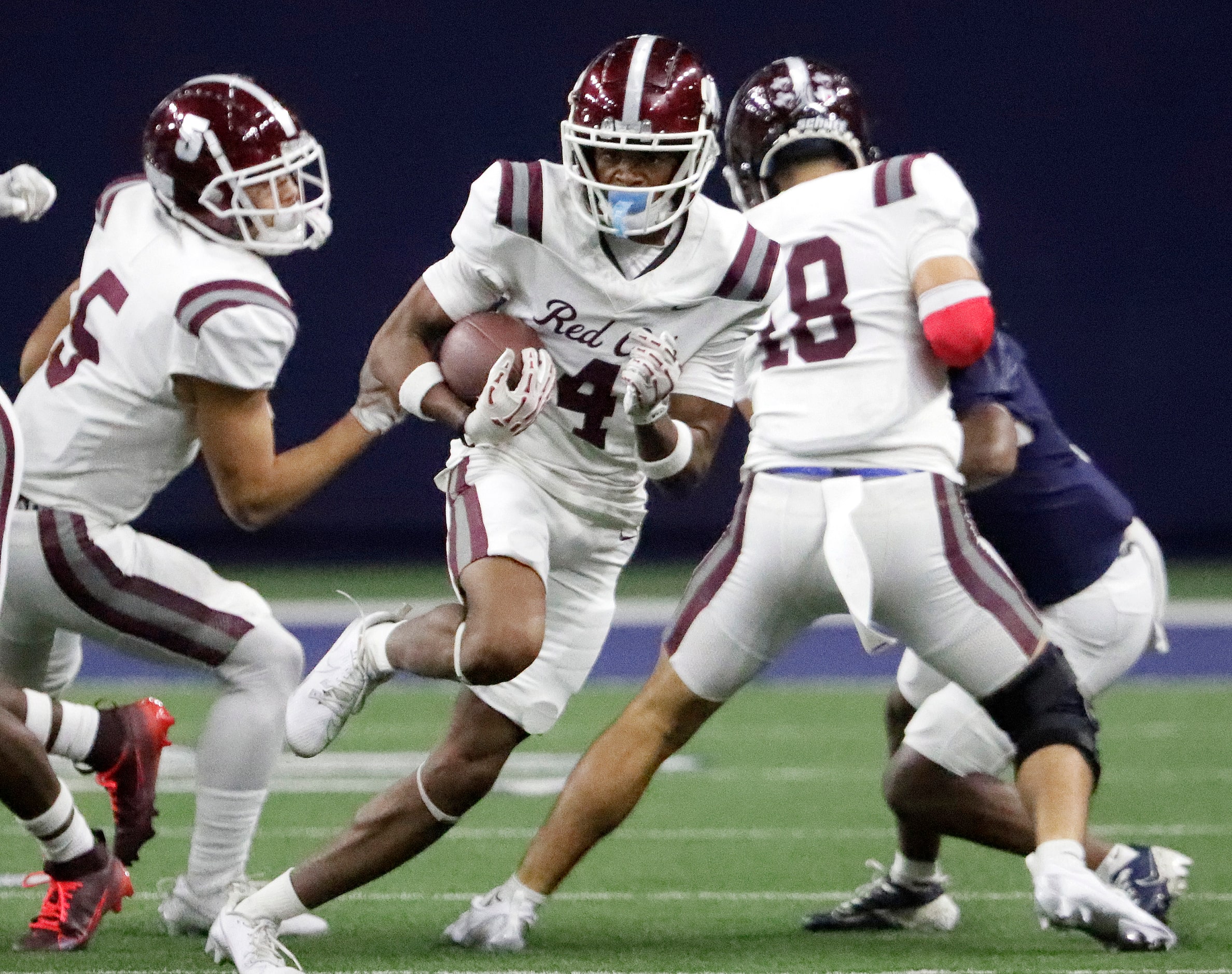 Red Oak High School wide receiver Charles Taplin (4) takes the opening kickoff as Lone Star...